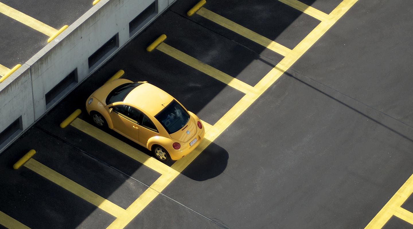 yellow car in car park